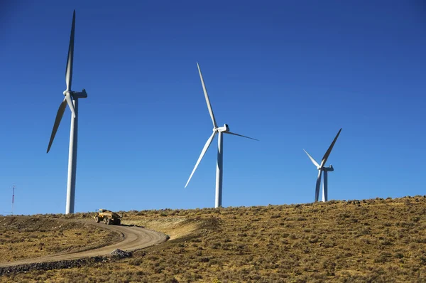 Wind turbines and dump truck. — Stock Photo, Image