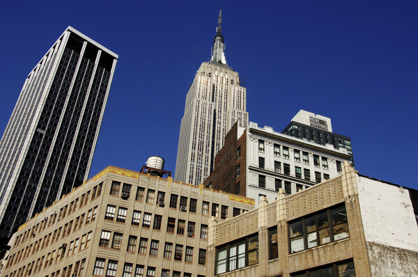 Empire State Building rising above other buildings in New York