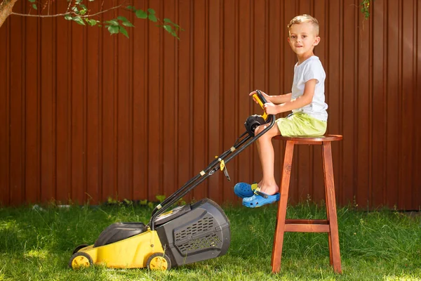 Blond Boy Mowing Lawn Garden Yellow Lawn Mower Sunny Summer — Photo