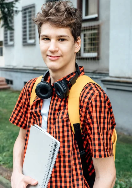 Cute Teenager Red Shirt Headphones Backpack Holding Notebook Front His —  Fotos de Stock