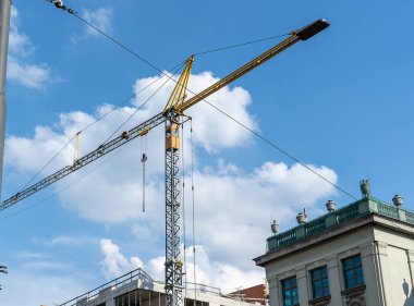 Building under construction. Tower cranes constructing a new building. Industrial background