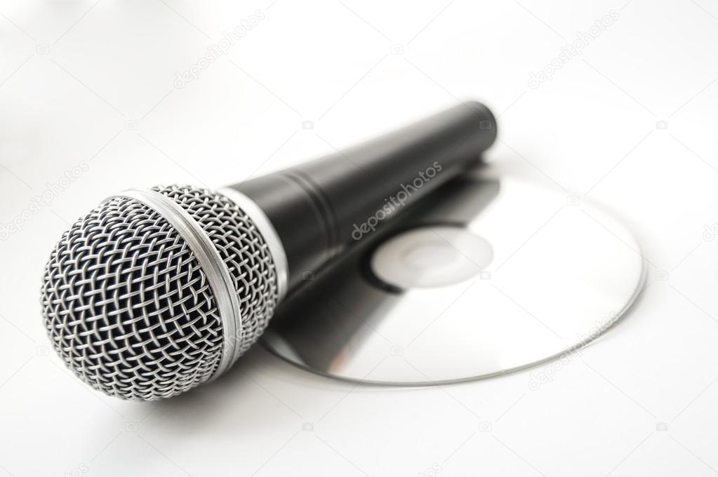 Microphone and cd disc on a white background