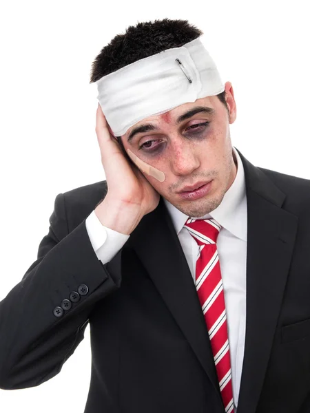 Businessman with bruised eyes and head — Stock Photo, Image