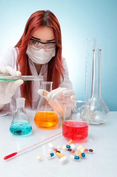 Chemist woman with test tubes — Stock Photo, Image