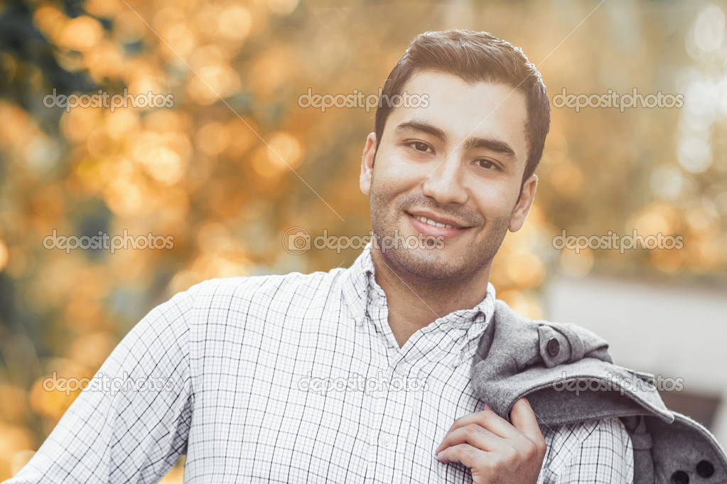 Portrait of gorgeous young smile man. Outdoor - outside