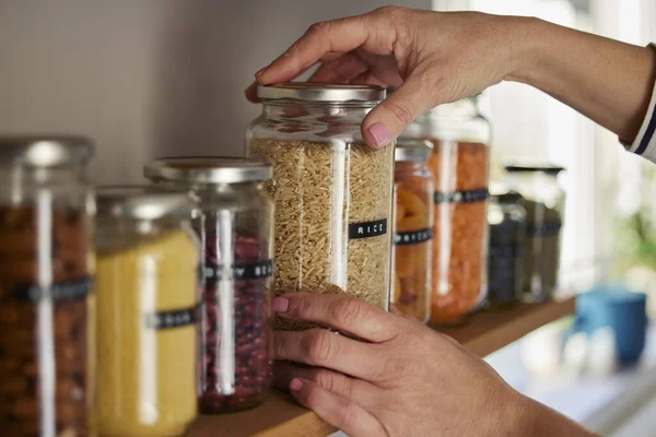 Woman Reusing Glass Jars Store Dried Food Living Sustainable Lifestyle — Stock Photo, Image