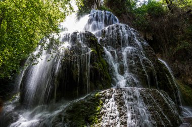 Waterfall from stone monastery, Zaragoza, Spain. clipart