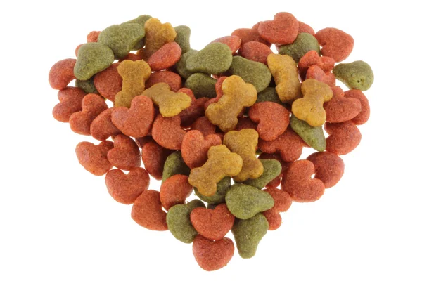 Dried food for dog, puppy, with a shape of heart — Stock Photo, Image