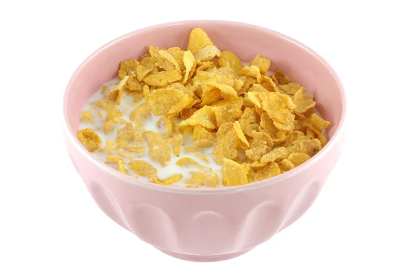 Un tazón rosado de cereales, copos de maíz y leche fresca baja en grasa —  Fotos de Stock