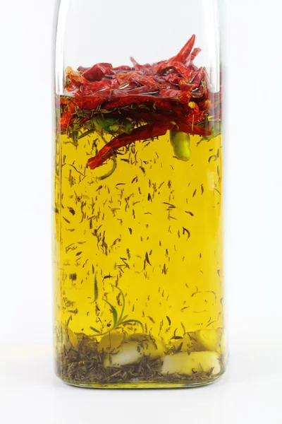 Homemade spicy olive oil with chili pepper, rosemary, garlic — Stock Photo, Image