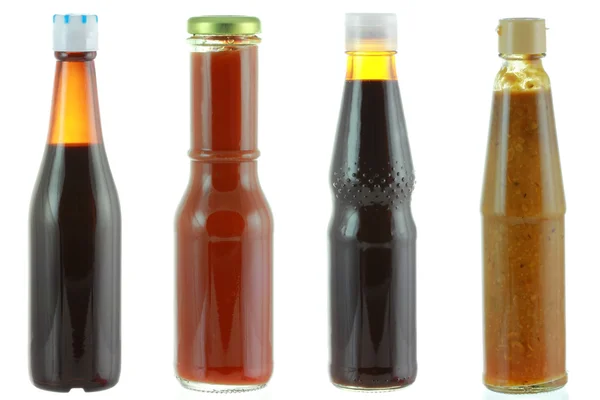 Diferentes botellas de salsa — Foto de Stock