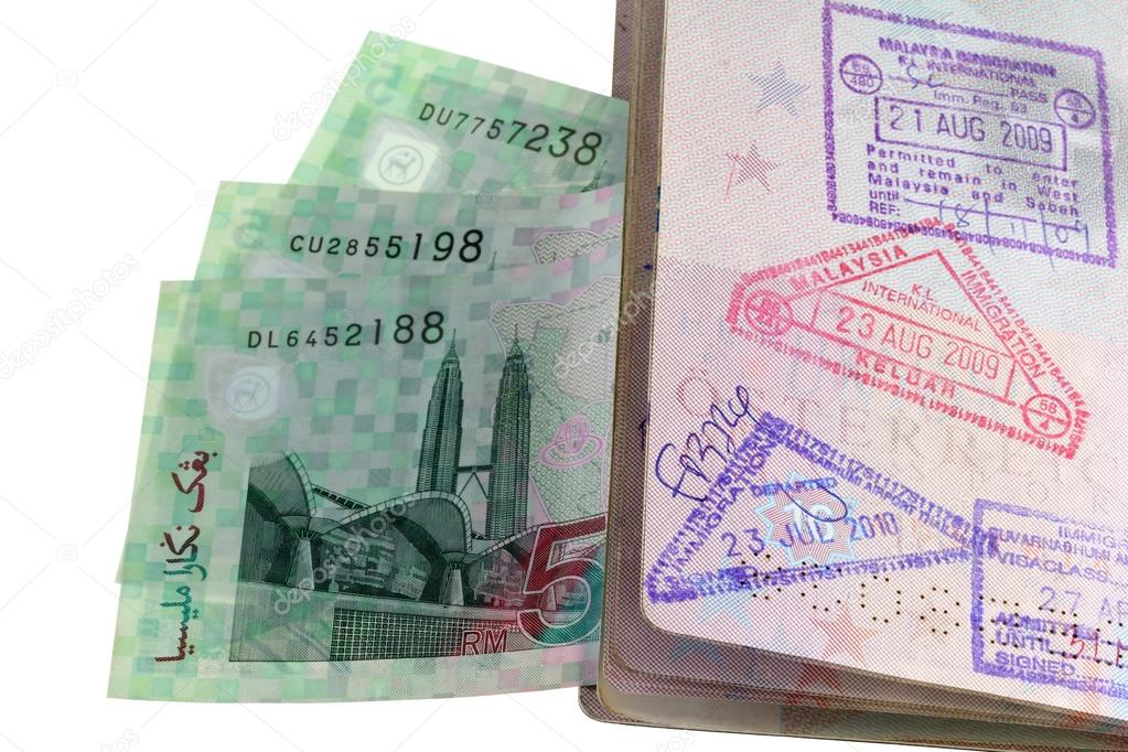 An entry and exit immigration stamp in the passport