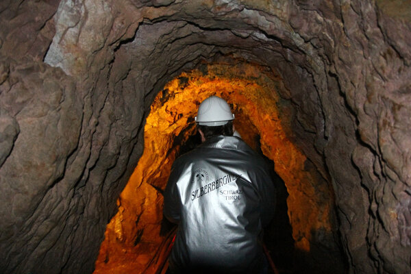 Tourists explore the mine using mini railway at the Silver Mine, Austria