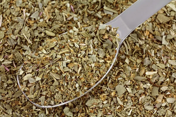 A spoon of dried Italian Seasoning mix — Stock Photo, Image