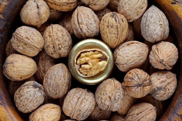 Closeup photo of Walnuts in a wooden bowl — Stock Photo, Image