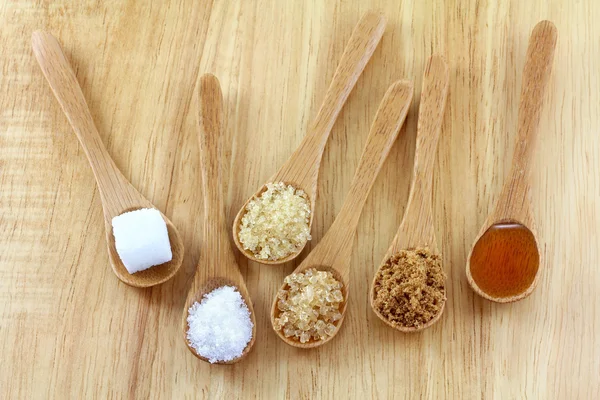 Spoons of different type of sugar — Stock Photo, Image