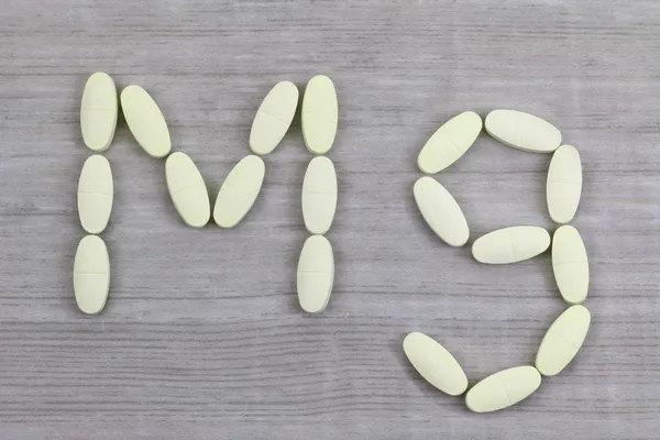 Magnesium tablets in a shape of Mg alphabet — Stock Photo, Image