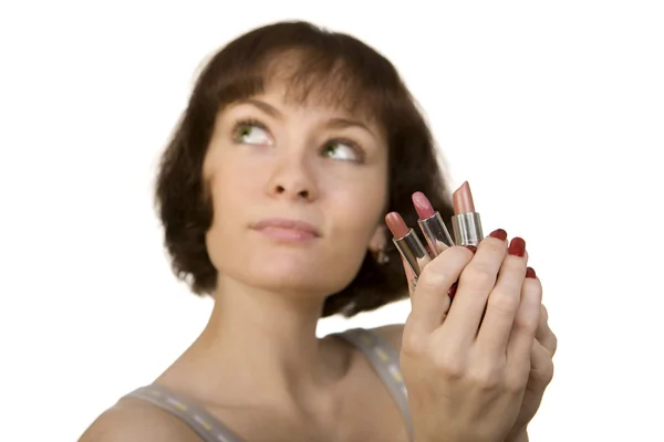 Woman choosing a lipstick — Stock Photo, Image