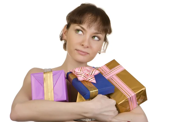 Dreaming girl with gifts — Stock Photo, Image