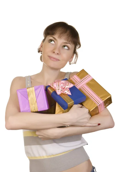 Dreaming girl with gifts — Stock Photo, Image