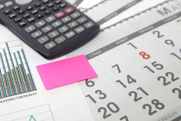 Graphics with calendar and calculator — Stock Photo, Image