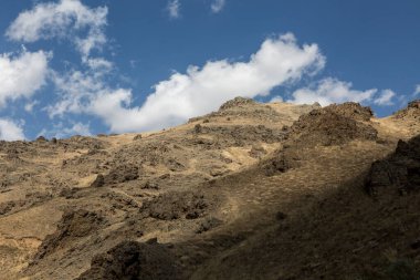 Andesite or volcanic rocks, volcanics in scientific contexts, is a rock formed from lava erupted from a volcano
