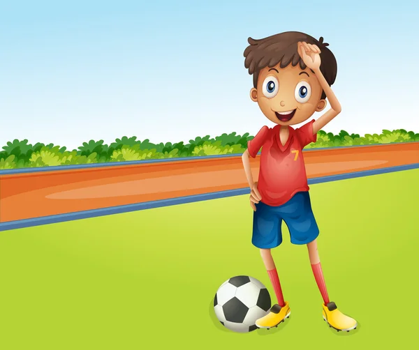 Un chico jugando al fútbol — Vector de stock