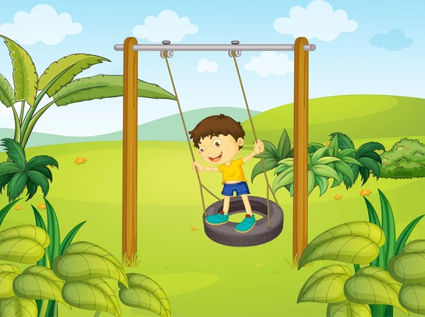 A little boy swinging — Stock Vector