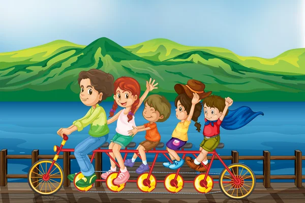 Niños en bicicleta en el puente — Vector de stock