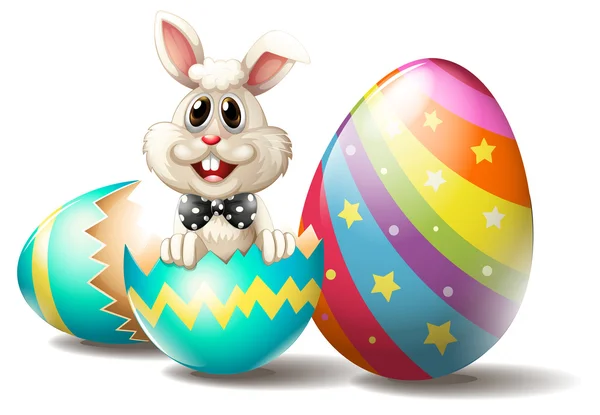 Um coelho dentro de um ovo de Páscoa rachado — Vetor de Stock