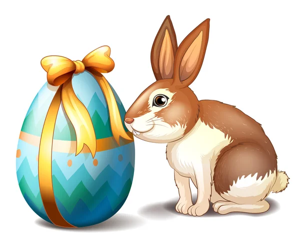 Een konijn en een easter egg met een lint — Stockvector