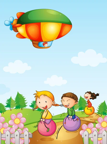 Tři děti hrají pod vzducholodí — Stockový vektor