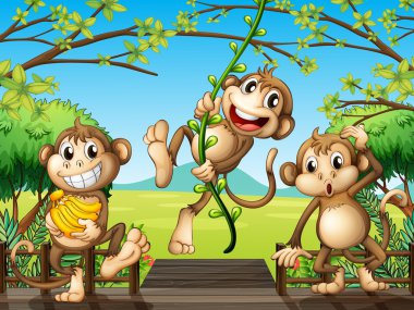 Three monkeys at the wooden bridge clipart