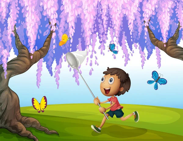 Un niño cogiendo mariposas en el parque — Vector de stock