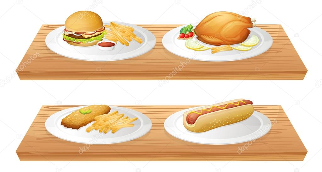 Wooden trays with plates of foods