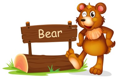 bir ayı bir tabela yanında