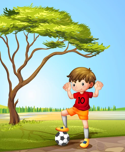 En pojke med en fotboll — Stock vektor