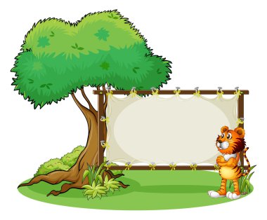 bir kaplan yanındaki boş çerçeveli tabela