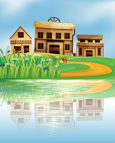 A pond with a reflection of the wooden houses — Stock Vector