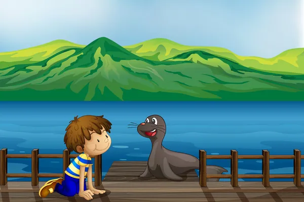 一个男孩和海狮 — 图库矢量图片