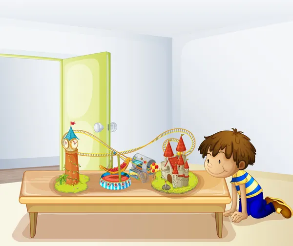 A boy looking at his toys — Stock Vector