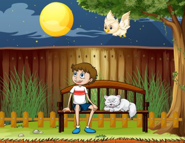 ile onun kedi çit içinde oturan bir çocuk