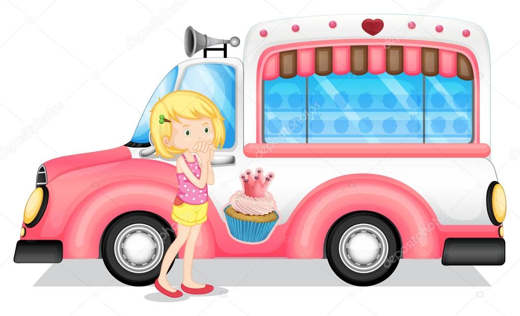 A young girl beside the pink bus
