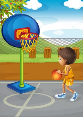 küçük bir çocuk basket oynarken