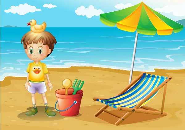 Un niño y sus juguetes en la playa — Vector de stock