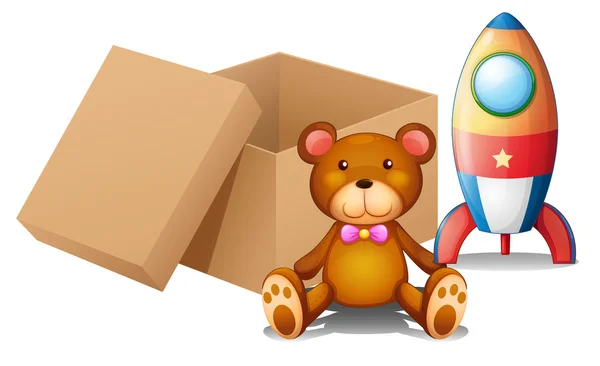 Two toys beside a box — Stock Vector