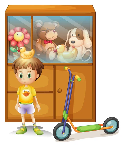 Un chico joven con su scooter y sus juguetes en un armario — Vector de stock