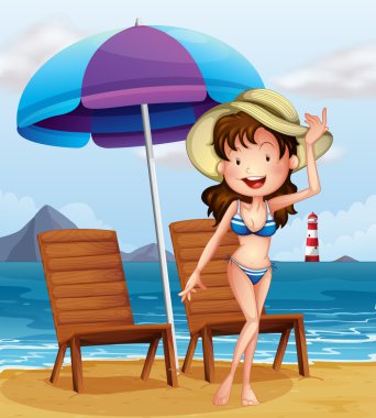 plajda bir şerit mayo giyen bir kadın