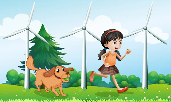 Une fille jouant avec son chien près des moulins à vent — Image vectorielle
