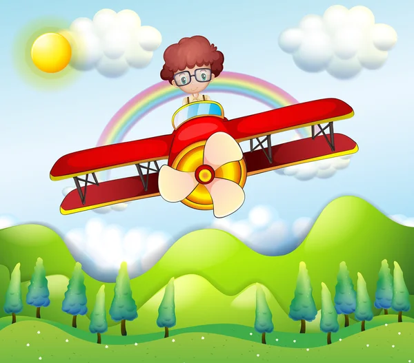 A boy riding in a red plane — Stock Vector